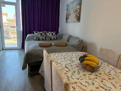 a room with a table with a bowl of bananas on it at Soleil Bleu in Nesebar