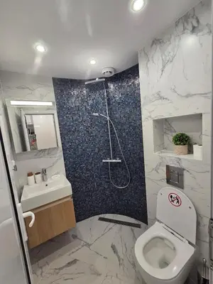 a bathroom with a shower and a toilet and a sink at Bit of sea in Varna City