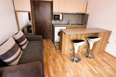 a small kitchen with a couch and a counter at Magnolia 3 - Menada Apartments in Sunny Beach