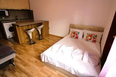 a bedroom with a bed with white sheets and pillows at Magnolia 3 - Menada Apartments in Sunny Beach