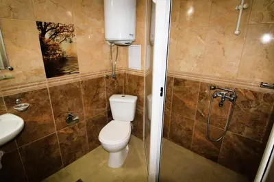 a bathroom with a toilet and a shower at Magnolia 3 - Menada Apartments in Sunny Beach