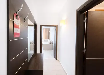 a hallway with a door leading to a room at Harmony Suites-2 Private Apartment 404 in Sunny Beach