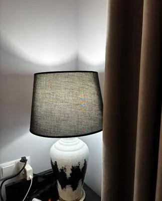 a lamp sitting on a table in a room at Golden Nest B25 in Nesebar