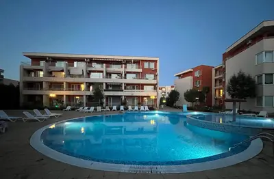 a large swimming pool in front of a building at Nessebar Fort Club in Sunny Beach