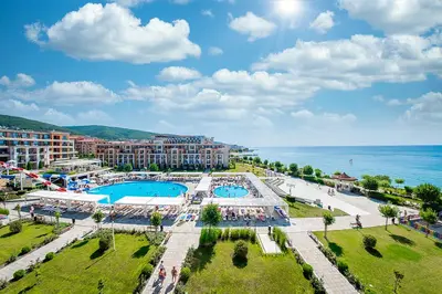 an aerial view of a resort with two pools and the ocean at Premier Fort Beach Aparthotel - Sunny Beach in Sveti Vlas
