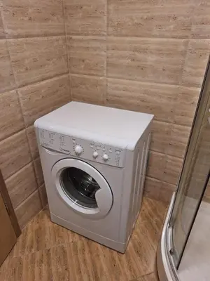 a washer and dryer in a small room at Premier Fort Beach Aparthotel - Sunny Beach in Sveti Vlas