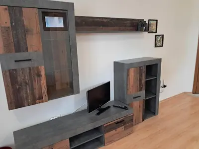 a living room with a tv on a wall at Apartment in Byala Vista Compex in Byala