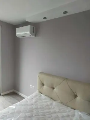 a bedroom with a bed and a ceiling fan at Izgrev View apartment bs in Burgas City
