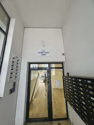 an entrance to a building with a glass door at Izgrev View apartment bs in Burgas City