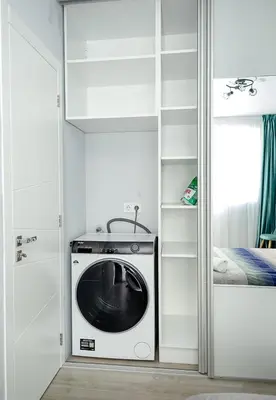 a kitchen with a black and white oven in a room at Stylish 2BR Apartment with Underground Parking, Varna by Flat Manаger in Varna City