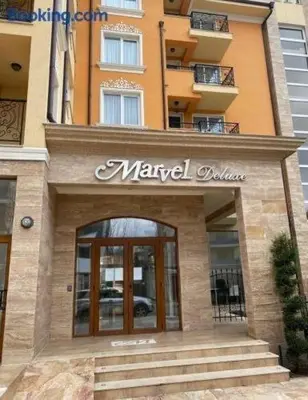 a sign for a marval boutique in front of a building at Marvel Deluxe in Sunny Beach