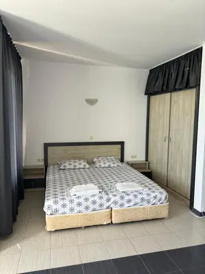 a bedroom with a large bed in a room at Beachside apartment - 100 meters from the sea in Chernomorets