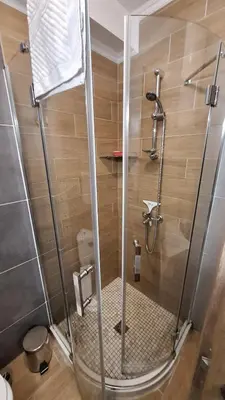 a shower with a glass door in a bathroom at 3 Room Apartment with Poolview in Cascadas Resort in Sunny Beach