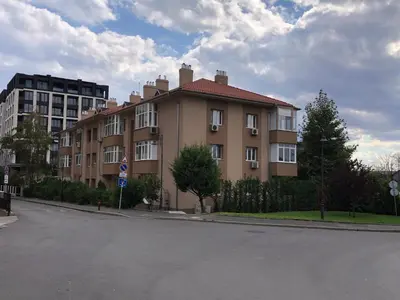 a large building on the side of a street at Calendula in Burgas City