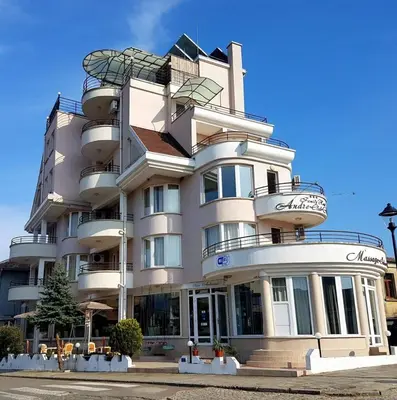 a large white building with a spiral at Hotel Andre in Burgas City