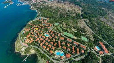 an aerial view of a resort on a hill next to the water at AJ Apartment 3, Santa Marina Holiday Village, Sozopol in Sozopol