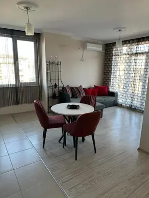 a living room with a table and chairs and a couch at 