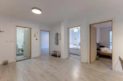 a room with doors and a room with a bedroom at Central 2BR - Workspace with Elevator in Varna City