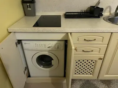 a kitchen with a washing machine under a counter at Elegant Studio near Beach - Terrace & Parking in Nesebar