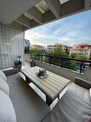a patio with a table and chairs on a balcony at Elegant Studio near Beach - Terrace & Parking in Nesebar