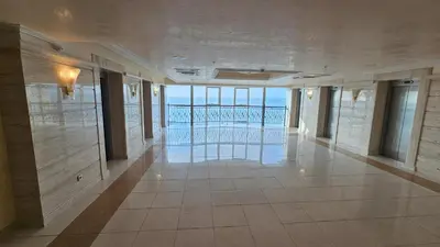 a hallway in a building with a view of the ocean at Sunset C8-10 Pomorie in Pomorie