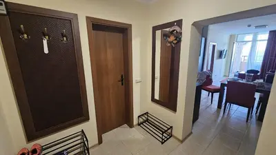 a hallway with a door and a dining room at Sunset C8-10 Pomorie in Pomorie