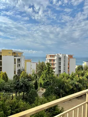 a view of buildings and the ocean from a balcony at Imperial Fort Club Studio Apartment in Sveti Vlas