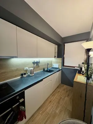 a kitchen with a sink and a large window at 1BD Apartment next to the Sea Garden by Flat Mаnager in Burgas City