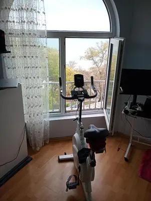 a room with a exercise bike in front of a window at Varna in Varna City