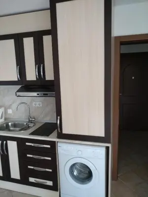 a kitchen with a washing machine and a sink at Oasis Resort&Spa Lozenets Studio 2 in Lozenets