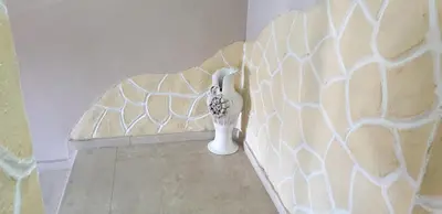 a vase sitting on a wall in a room at Морската Къща in Tsarevo