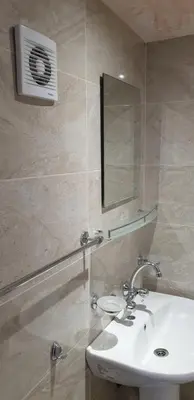 a bathroom with a sink and a mirror at Морската Къща in Tsarevo