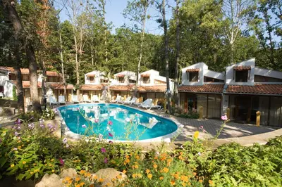 a house with a swimming pool in a yard at Villas Ropotamo Maisonette in Primorsko