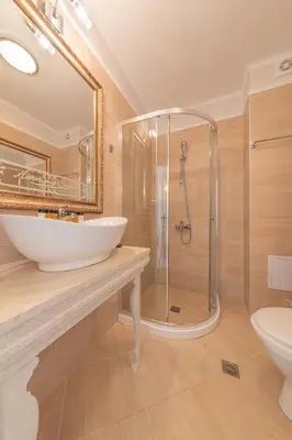 a bathroom with a sink and a shower at Harmony Suites - Dream Island in Sunny Beach