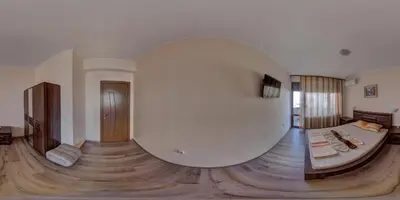 a living room with a large white room with a bed at Hotel Fantasy Beach in Sveti Vlas