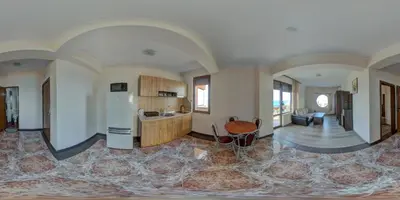 a large room with a kitchen and a living room at Hotel Fantasy Beach in Sveti Vlas