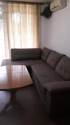 a living room with a couch and a coffee table at Sea Bedroom Apartments in Nesebar
