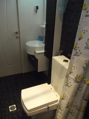 a bathroom with a toilet and a sink at Apartment Sredna Gora in Burgas City