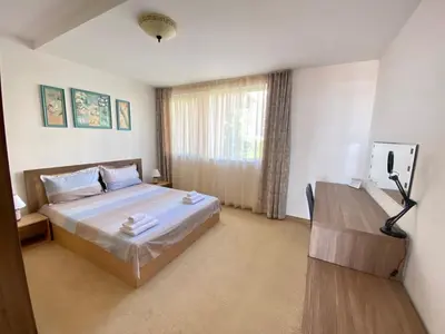 a hotel room with a bed and a window at Apartments Bellevue in Ravda