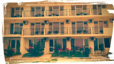 an apartment building with flowers on the balconies at Family Hotel Ludo in Varna City
