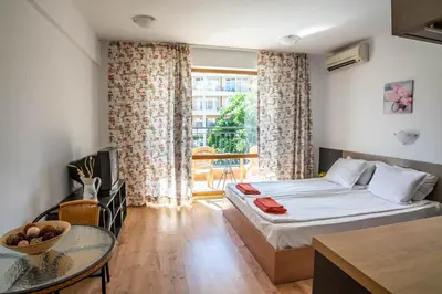 a hotel room with a bed and a table at Step Hotel in Sunny Beach