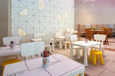 a dining room with white tables and chairs at Hotel Marvel All Inclusive - FULLY RENOVATED FREE Beach Access in Sunny Beach