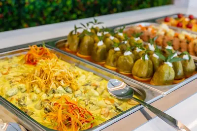a buffet filled with different types of food on display at Hotel Bavaro in Sunny Beach