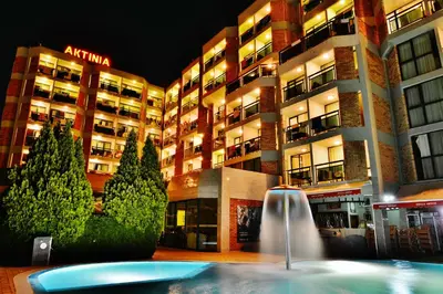a building with a fountain in front of a building at Hotel Aktinia - All Inclusive in Sunny Beach