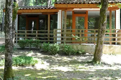 a house with a fence in front of it at Villas Ropotamo in Primorsko