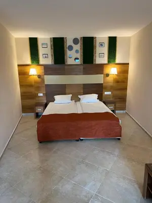 a bedroom with a large bed in a room at Briz Beach apartments - section B in Sunny Beach