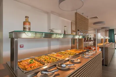 a buffet line with many different types of food at Hotel Pomorie Sun - All Inclusive in Sunny Beach