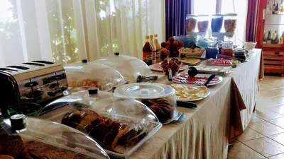 a buffet with many different types of food on a table at Hotel Diamanti in Sozopol