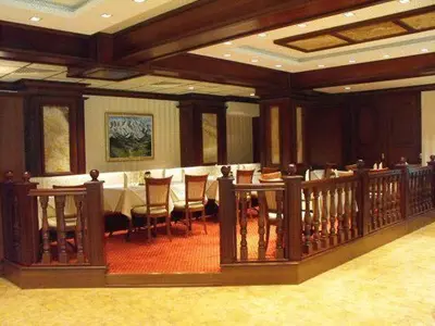 a dining room with a long table and chairs at Hotel Park in Karnobat