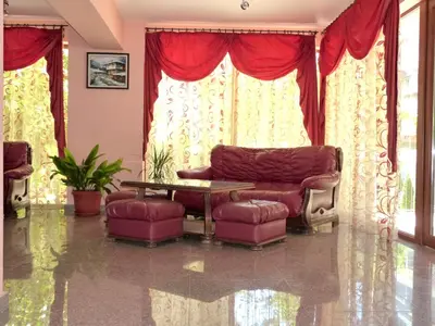 a living room with a couch and a table at Hotel Beroe in Sveti Vlas